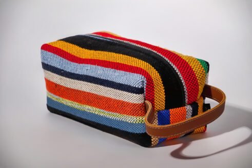 Colorful striped cosmetic pouch with handle, perfect for organizing your beauty essentials.