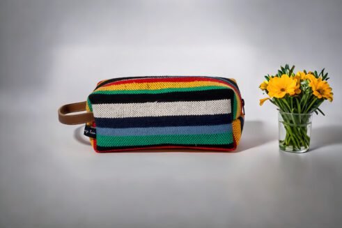 Colorful striped cosmetic pouch with handle, perfect for organizing your beauty essentials.