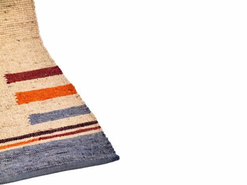 Handwoven Moroccan wool rug with vibrant geometric patterns, blending tradition and modern aesthetics for a stylish addition to any home