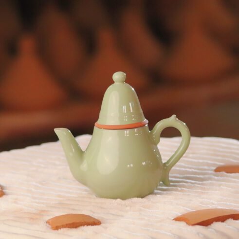 Green ceramic teapot